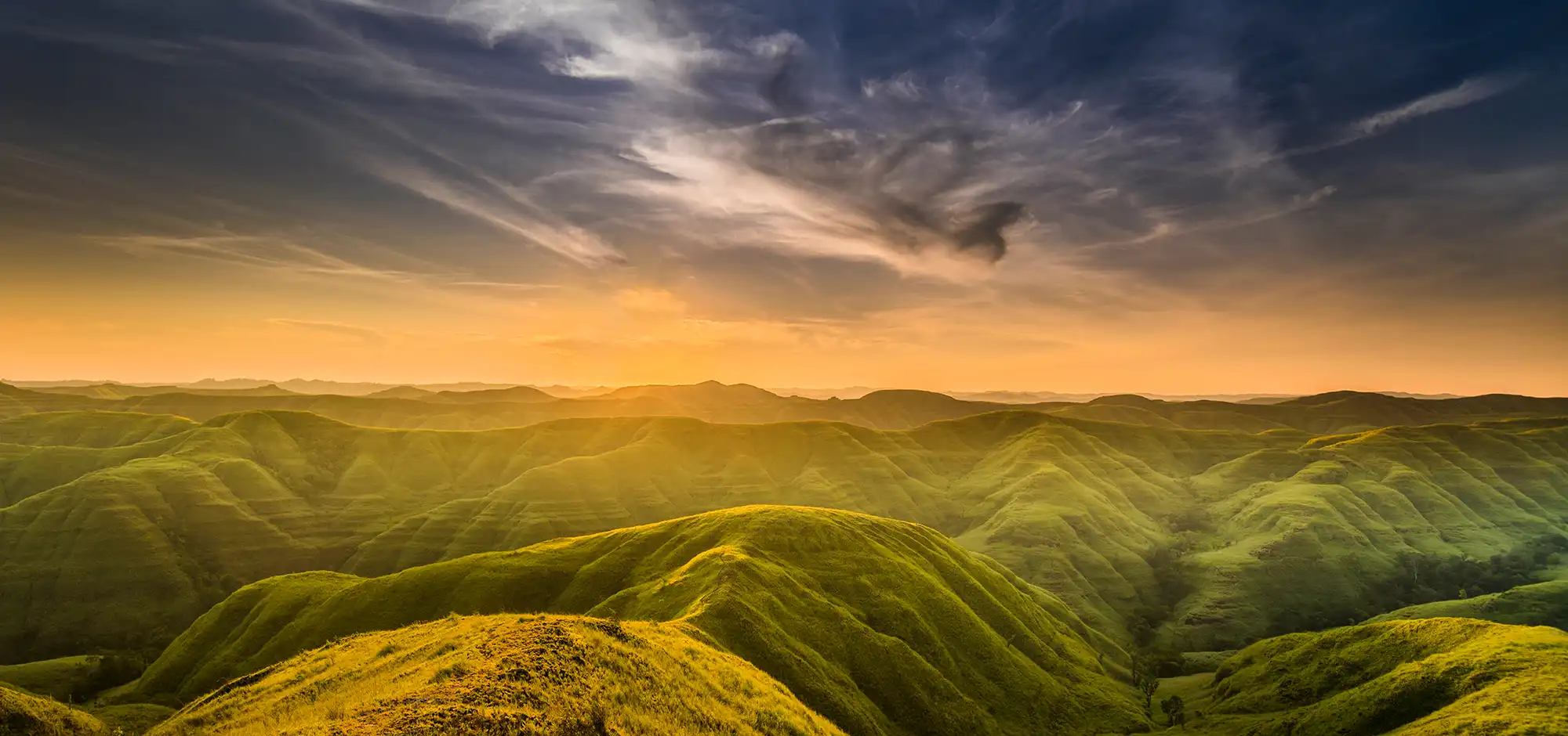 The rolling grass ridges of Warinding Hill in East Sumba